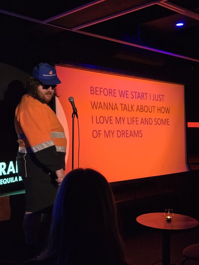 A comic performing at Powerpoint Show
